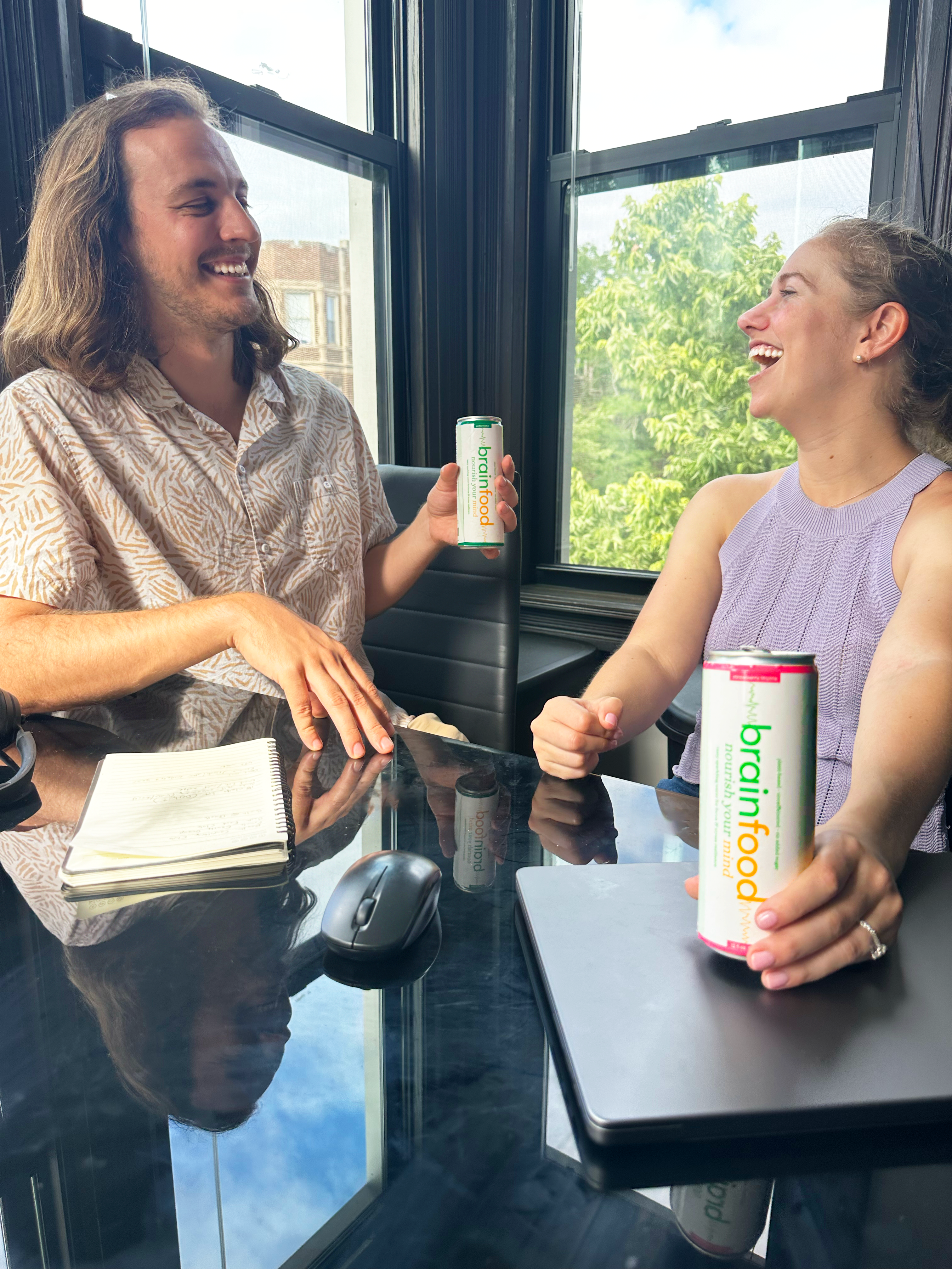 Two people laughing while holding brain food